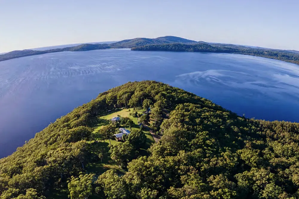 Sea Eagle Point — The center is set on a vast 100-acre property, characterized by its natural beauty and proximity to water. Guests are enveloped by the serene environment, with rainforests to explore and the famous Blueys Beach nearby, offering a blend of lush greenery and coastal charm.