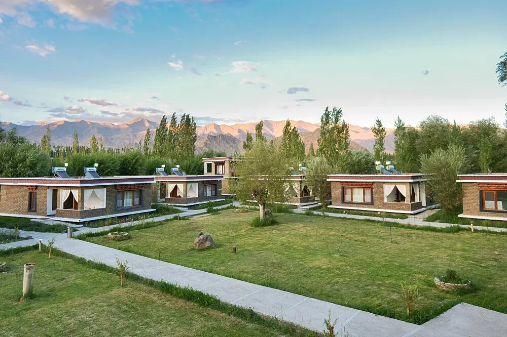 Secret luxury stay — This resort is situated in a peaceful village at the southern end of Leh, offering a tranquil escape from the main town. It rests on the banks of the gleaming Indus River, surrounded by the picturesque Himalayas. A government-declared forest site nearby attracts a variety of Himalayan birds, making it ideal for nature enthusiasts.