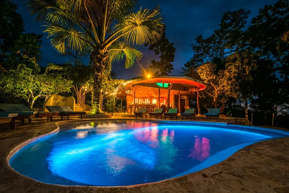 La Selva Armonia — Perched in the lush jungle mountains of Uvita, Costa Rica, the center is enveloped by the natural beauty of the rainforest. The atmosphere is one of serene immersion, where the sounds of wildlife and the vibrant greenery create a deeply calming and inspiring backdrop for your stay. It's a place where the natural environment plays a central role in shaping the guest experience.