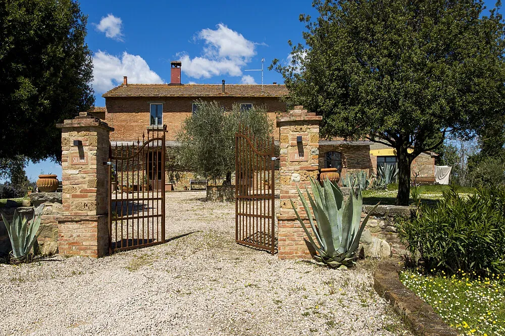 Siliano Alto — Siliano Alto is situated within a secluded wilderness estate in the Umbrian hills, offering endless views of rolling landscapes and verdant woodlands. The atmosphere is one of rustic tranquility, with the ancient farmhouse surrounded by green fields and fragrant wildflowers, creating a profound sense of peace and removal from modern life.