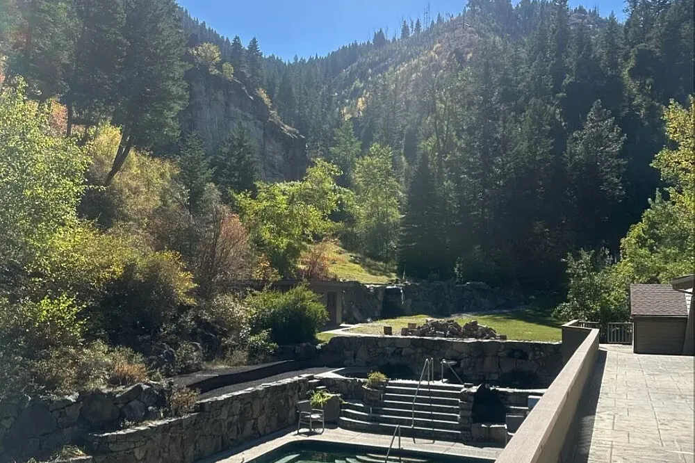 Sleeping Child Hot Springs — The retreat is situated in a private, natural environment, with the main draw being its hot springs. The atmosphere is one of secluded tranquility, allowing for deep relaxation and personal reflection amidst the natural surroundings.