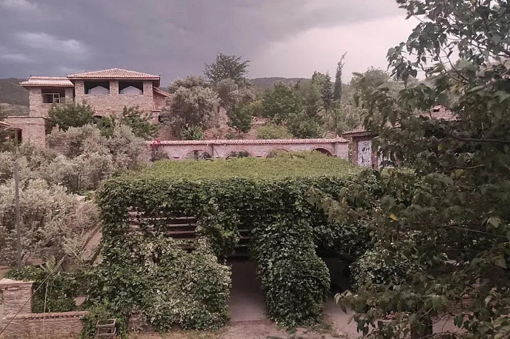 StoA — The center is situated within the serene hills of Şirince, Turkey, enveloped by ancient olive groves and breathtaking natural landscapes. This environment provides a tranquil backdrop, fostering an atmosphere conducive to introspection and connection with nature.