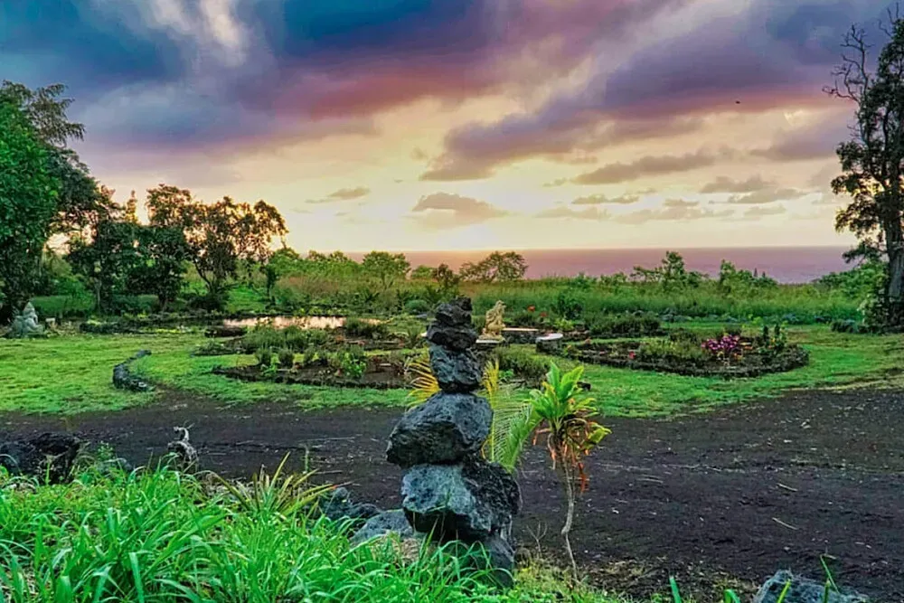 Sundari Farms and Gardens — set in Kalapana, Hawaii, Sundari Farms and Gardens spans ten acres of breathtaking natural beauty. The landscape is a harmonious blend of sweeping ocean vistas, vibrant fruit trees, colorful flowers, artistic statues, and tranquil ponds, creating a serene and visually rich environment that encourages relaxation and introspection.