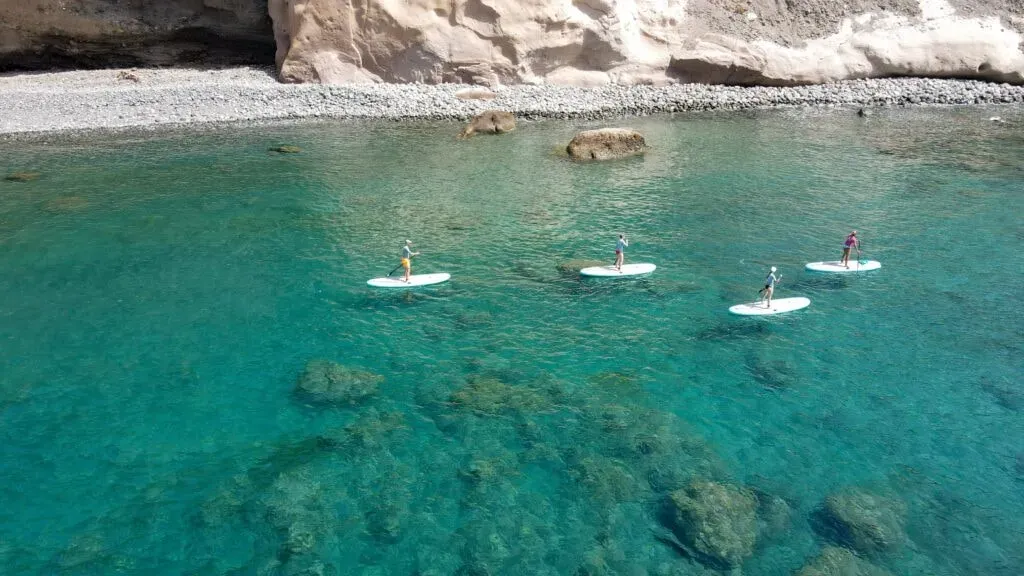 SUP FIT YOGA — Located in Arguineguín, a sunny village on the south of Gran Canaria, the activities take place directly on the beautiful Playa de Las Marañuelas. The setting provides a vibrant coastal atmosphere, with the calming presence of the ocean and abundant sunshine, offering a natural playground for paddleboarding and yoga.