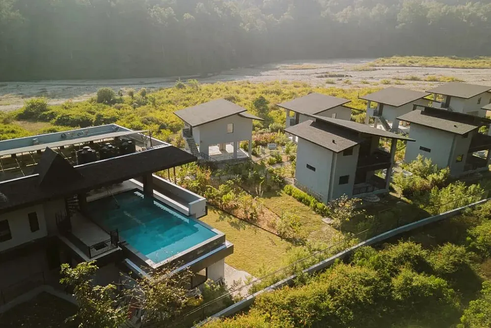 The Gaj — The Gaj is set within a vibrant forest landscape in Lansdowne, offering an intimate connection with nature. The atmosphere is one of quiet reverence for the environment, shaped by decades of dedicated preservation by the host family. Expect lush greenery, the sounds of the forest, and a sense of being truly away from it all.