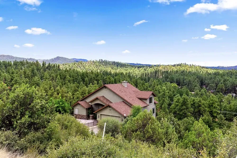 The Sanctuary In Prescott Arizona — The Sanctuary is set on more than an acre of private forested land, enveloped by towering ponderosa pines. This tranquil mountain setting provides a quiet escape, yet remains conveniently close to downtown Prescott. The natural surroundings foster an atmosphere of peace and introspection, well suited to a retreat experience.