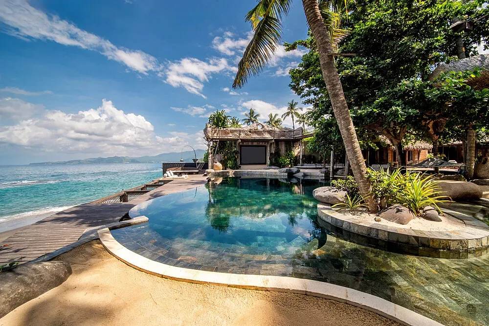 THE SEED — The Seed is situated in Candidasa, East Bali, offering a picturesque landscape where sandy beaches meet dramatic mountain ranges. The atmosphere is one of serene privacy and natural beauty, providing a tranquil backdrop for personalized retreats.