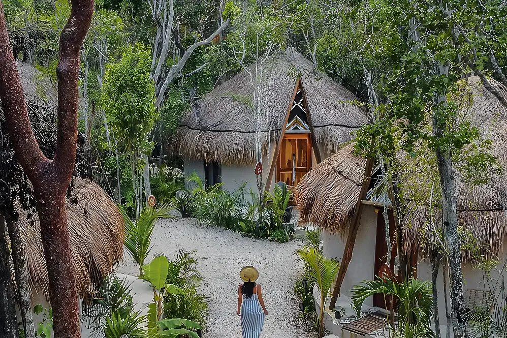 The Yellow Nest — set in the vibrant landscape of Tulum, The Yellow Nest is surrounded by the area's iconic cenotes and lush jungle. The atmosphere is one of natural tranquility, inviting guests to connect with the stunning environment. Expect a peaceful ambiance, well suited to unwinding and exploring the unique natural wonders of the Yucatán Peninsula.