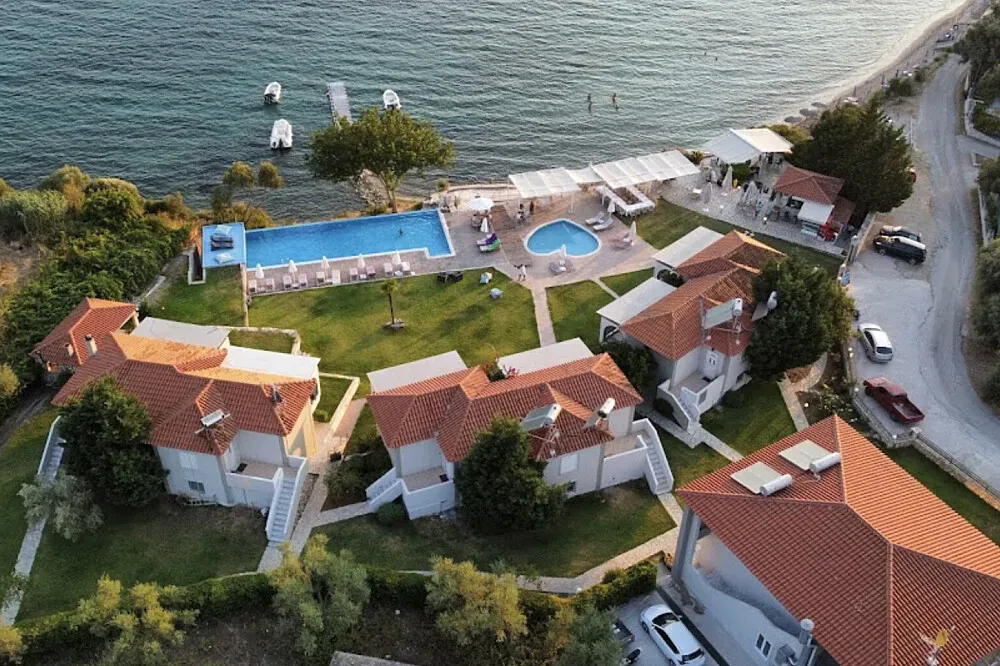 Thesmos Hotel — The specific location within Greece is not detailed, but the country itself offers a rich tapestry of landscapes, from ancient ruins to stunning coastlines and tranquil olive groves. Expect a Mediterranean climate and an atmosphere that encourages relaxation and introspection.
