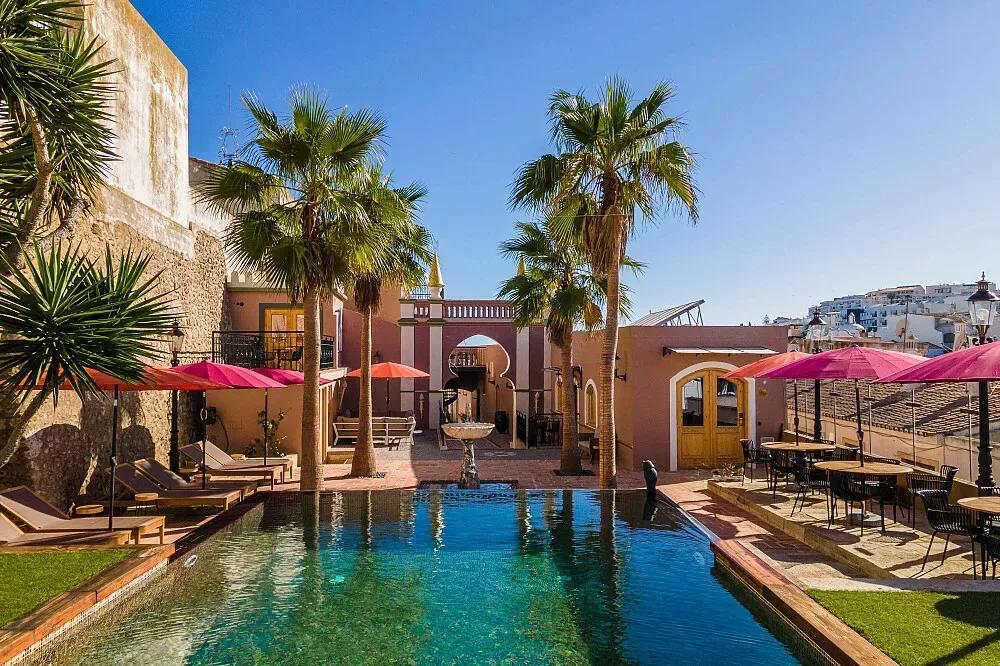 Vila Origens Boutique Hotel — Albufeira, a lively coastal city in the Algarve region of southern Portugal, is known for its stunning beaches, vibrant nightlife, and historic old town. The area boasts a Mediterranean climate, with plenty of sunshine, making it an ideal location for a restorative escape.