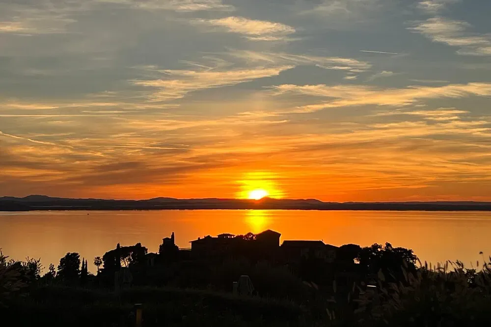 Villa Battisole — Monte del Lago, where Villa Battisole is situated, offers picturesque views of Lake Trasimeno and the rolling Umbrian hills. The landscape is characterized by olive groves, vineyards, and charming Italian villages, creating a peaceful and inspiring atmosphere for a retreat.