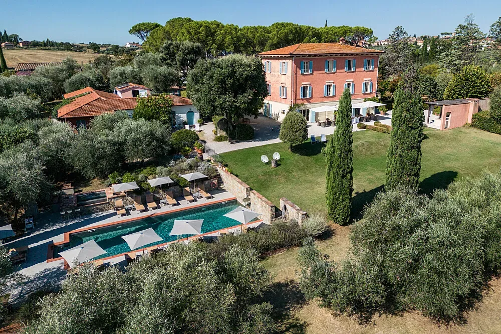 Villa Fontelunga — The retreat is set within its own sprawling olive grove, providing a peaceful and picturesque backdrop. Guests can enjoy beautiful, expansive views of the Tuscan countryside, creating an atmosphere of serene natural beauty and quiet contemplation.