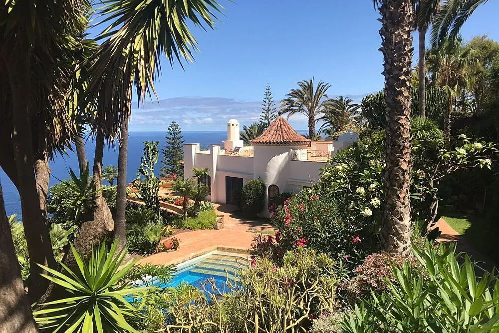 Villas Punta del Sol — Villas Punta del Sol is situated on the picturesque north coast of Tenerife, offering breathtaking views of the Atlantic Ocean. The property is surrounded by vibrant subtropical gardens, creating a lush and serene environment that feels far removed from the everyday. The atmosphere is one of quiet tranquility, ideal for those seeking a peaceful respite.