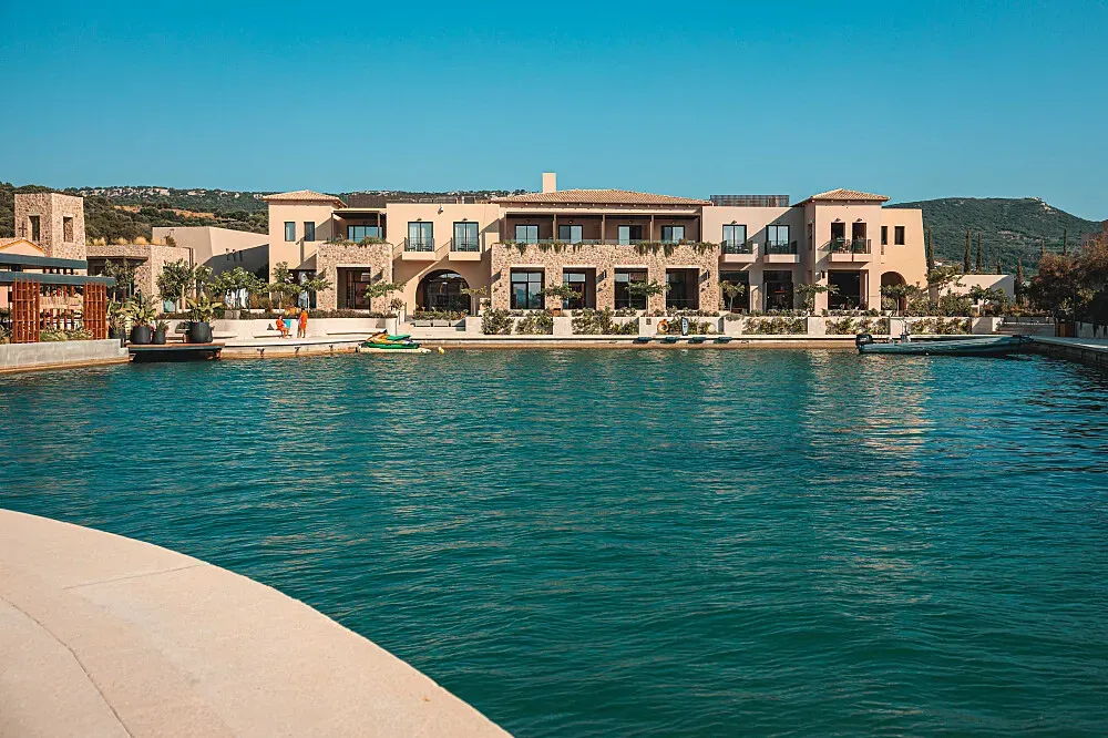 W Costa Navarino — Perched on the stunning Navarino Waterfront along the Ionian Sea, W Costa Navarino is surrounded by the natural beauty and rich history of Messinia. The architectural design draws inspiration from the traditional stone towers of the Mani Peninsula, creating a harmonious blend with the coastal landscape.