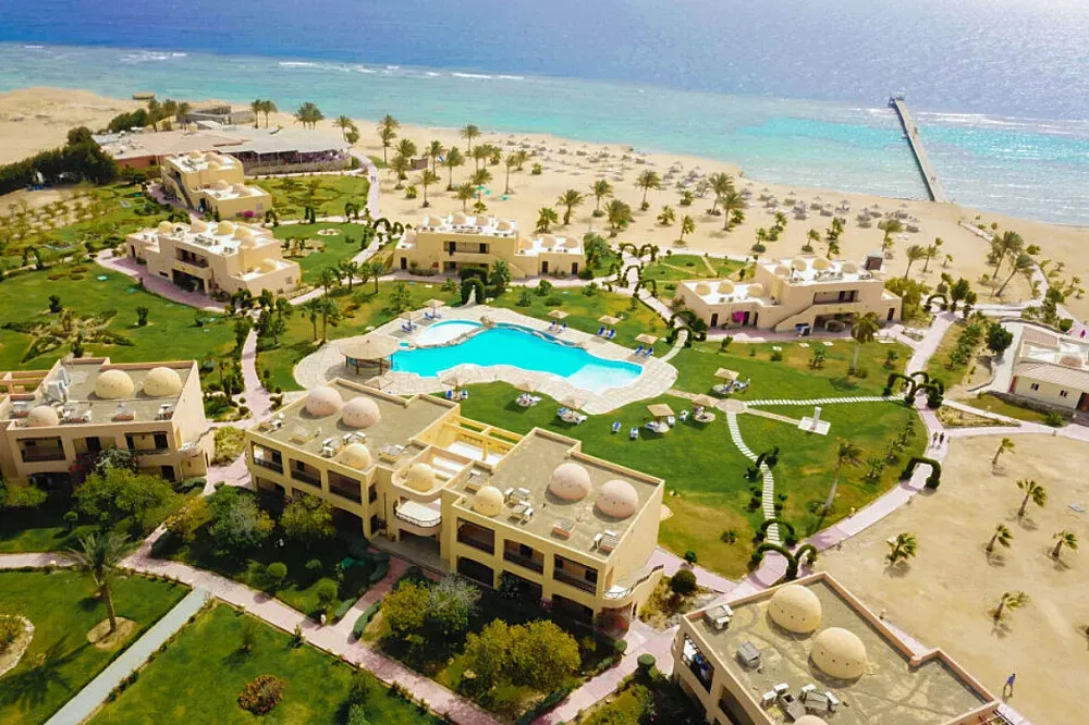 Wadi Lahmi Azur Resort — Located approximately 112 km south of Marsa Alam, Egypt, the resort boasts a secluded private beach and offers stunning views of the Red Sea from its freshwater outdoor pool. The atmosphere is one of peaceful relaxation, with the vast desert landscape meeting the vibrant marine environment.