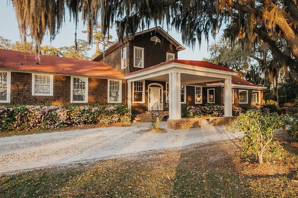 Wesley Gardens Retreat — The retreat is situated on the scenic banks of Moon River in Savannah, Georgia. It is characterized by towering oak trees draped in Spanish moss, creating a peaceful and reflective atmosphere. Winding trails invite quiet exploration of the natural surroundings.