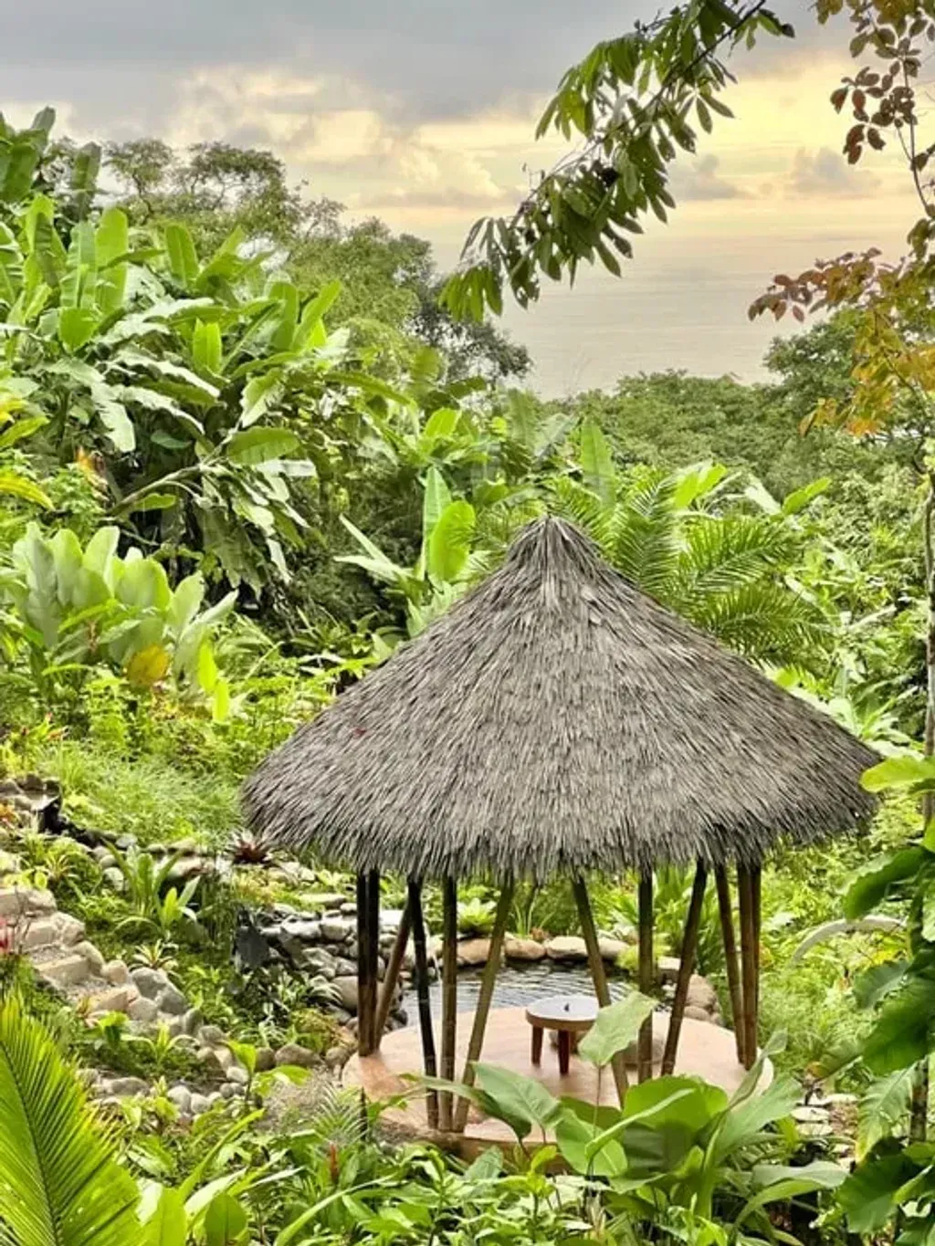 Wilder Sanctuary — Nestled within 30 acres of primary rainforest in Costa Rica's South Pacific, Wilder Sanctuary boasts expansive 180-degree ocean panoramas that seamlessly blend with dramatic mountain landscapes. The atmosphere is one of profound tranquility and immersion, where abundant wildlife like monkeys, scarlet macaws, and toucans are daily companions, creating a truly grounding experience.