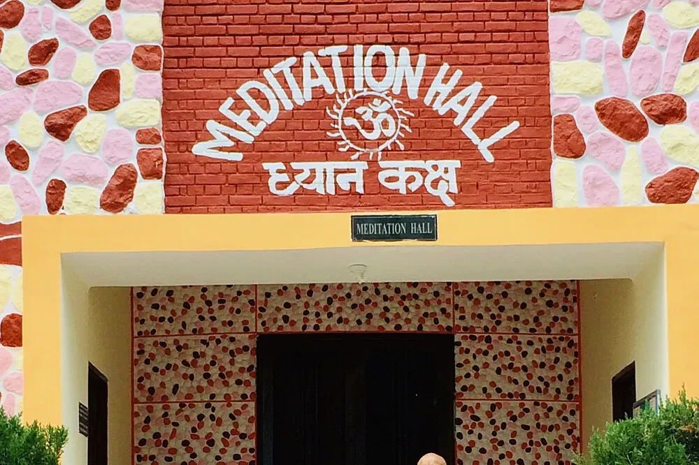 Yoga Niketan Ashram — Rishikesh, often called the 'Yoga Capital of the World,' provides a naturally inspiring backdrop for spiritual pursuits. The ashram's specific location within this vibrant town is not detailed, but one can expect the general atmosphere of the Ganges River and surrounding foothills to contribute to a sense of peace and contemplation.