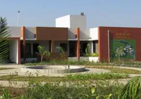 Dhamma Ambika — Situated in the village of Vagalwad, Dhamma Ambika is positioned just two kilometers west of the Boriyach toll plaza on National Highway no. 8, which connects Mumbai and Ahmedabad. This location suggests a landscape that balances the convenience of a major thoroughfare with the quietude of a rural village, providing an accessible yet peaceful environment for meditation.