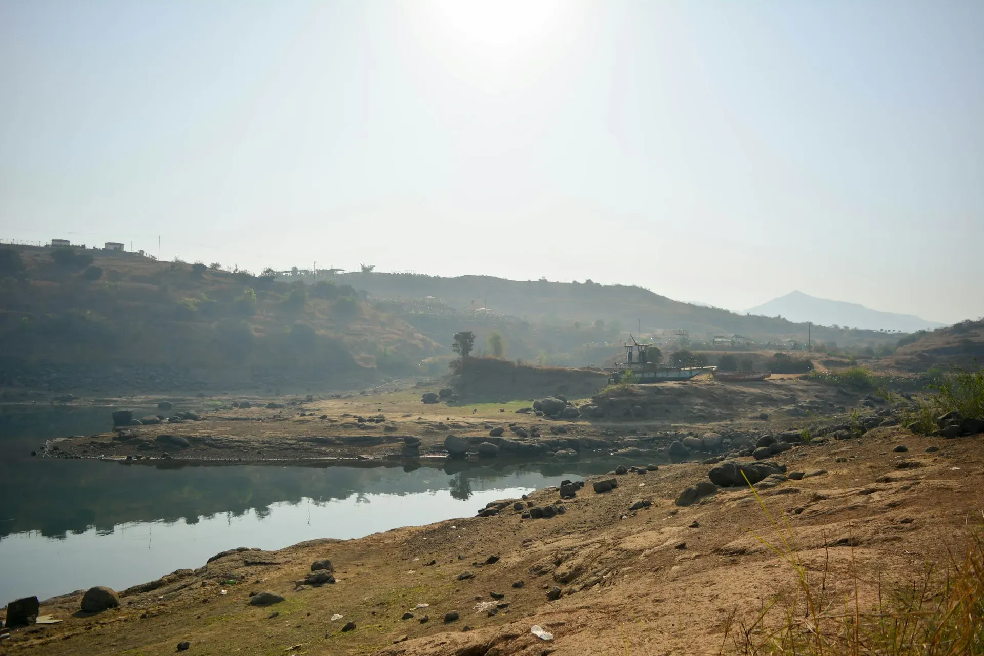 Dhamma Bhusana — The center is situated about 1 km from the Tapi River on a piece of land spanning approximately 18,000 square feet. Landscaping work is in progress, with nearly a hundred trees already planted, contributing to a developing natural environment.