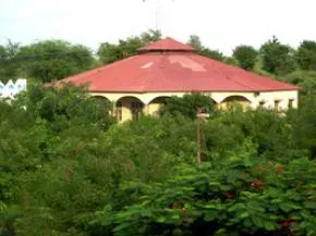 Dhamma Divakara — Located in the western Indian state of Gujarat, Dhamma Divakara is situated approximately 75 km from Ahmedabad and 14 km from Mehsana. The surrounding area offers a blend of rural tranquility and proximity to regional landmarks, including the notable Sun Temple just 15 km away. This setting provides a peaceful backdrop for meditation while remaining accessible.