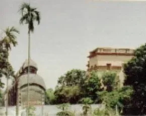 Dhamma Ganga — Dhamma Ganga is situated directly on the bank of the Ganges River, about 25 kilometers north of Kolkata. The center is housed in a 200-year-old, three-storied building, surrounded by a verdant landscape of flower and fruit trees, creating a peaceful and historic ambiance.