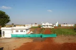 Dhamma Guna — The center is set on 1.5 acres of land, surrounded by verdant agricultural fields in Village Pagara, just outside Guna. This rural Indian landscape offers a peaceful and natural backdrop for meditation practice, far from the distractions of urban life.