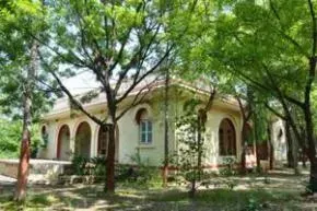 Dhamma Sarovara — The center is located near the Dedargaon Water Plant on the Mumbai-Agra Road, occupying a very calm and peaceful 35-acre site. The natural surroundings provide a tranquil atmosphere conducive to deep meditation practice.