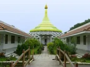 Dhamma Setu — Dhamma Setu is situated on 18 acres of land, surrounded by expansive paddy fields and open farmland. This rural environment provides a quiet and natural backdrop, offering a distinct contrast to the nearby urban sprawl of Chennai. The atmosphere is one of peaceful seclusion, conducive to deep meditative practice.