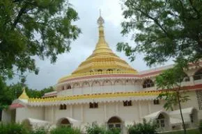 Dhamma Sindhu — Dhamma Sindhu is situated on a quiet 14-hectare property, remarkably close to the Arabian Sea. The grounds are a natural sanctuary, home to peacocks and a variety of songbirds, creating a vibrant yet peaceful soundscape. The coastal location ensures a moderate climate, with a consistent sea breeze providing natural cooling.
