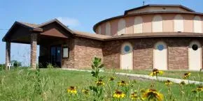Dhamma Sirī — Nestled on 20 acres of quiet rural land, Dhamma Sirī provides a peaceful environment away from urban distractions. The center is situated near the end of a country road, offering a sense of seclusion and calm conducive to meditation practice. The Texas landscape surrounding the center contributes to an atmosphere of natural tranquility.