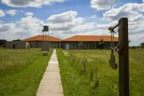 Dhamma Sukhada — The center is situated on the outskirts of Brandsen, offering a peaceful rural environment away from the city. Its location in the province of Buenos Aires suggests a landscape typical of the Argentine pampas, likely featuring open spaces and a quiet atmosphere conducive to meditation.