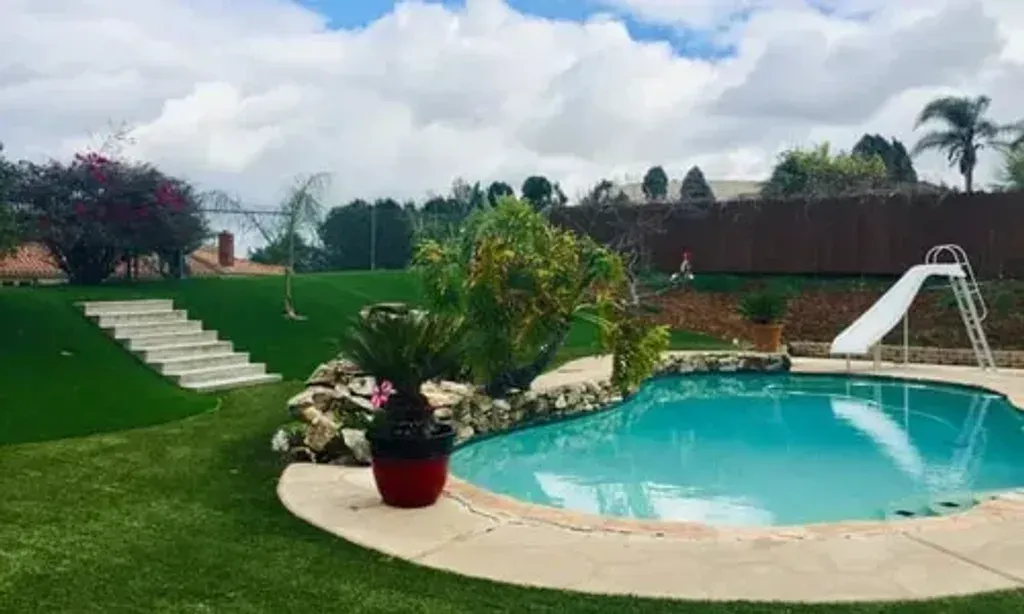 A One Fasting Retreat — The retreat is situated in a relaxing backyard environment in El Cajon, California. Guests can enjoy the outdoor amenities, including a pool, Jacuzzi, and sauna, which contribute to a peaceful and restorative atmosphere.