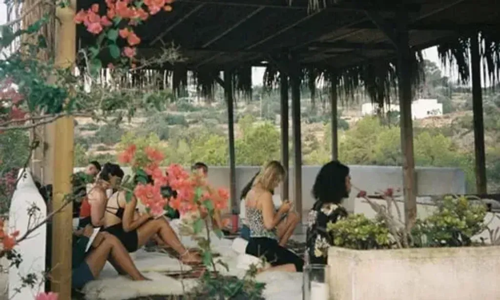 Ana Rosa Ibanez — The retreat unfolds at Har en Mar, a traditional Finca situated in a serene valley near Cala Salada in Ibiza. The property offers a peaceful atmosphere with abundant sunshine, ancient olive trees, and fresh flowers. Shaded areas provide cool respite, while dedicated spaces for yoga and comfortable cushions for enjoying detoxifying juices invite relaxation. The proximity to stunning beaches like Sandy Cala Saladeta and the rocky shores of Punta Galera, just minutes away, adds to the natural allure.