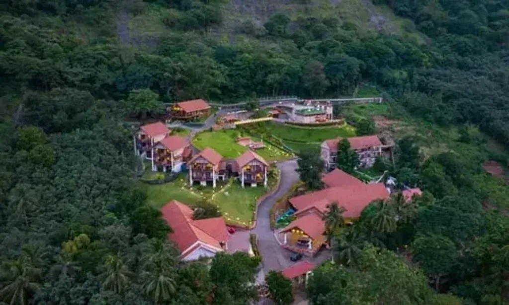 Au Revoir Wellness Resort — The resort is situated in the breathtaking Malampuzha valley, part of the Western Ghats at the Palakkad Pass. It's a serene location away from urban bustle, characterized by misty mountains, abundant greenery, and calming natural sounds, creating an atmosphere of peaceful luxury.