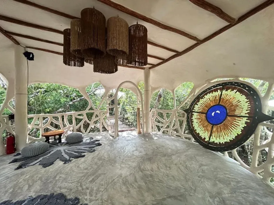 Awakened & Aligned — The retreat is set within Ikalar, featuring a treehouse with garden views. Guests can enjoy an infinity pool, an open-air bath, and a sun terrace, creating a serene and natural environment for relaxation and introspection.