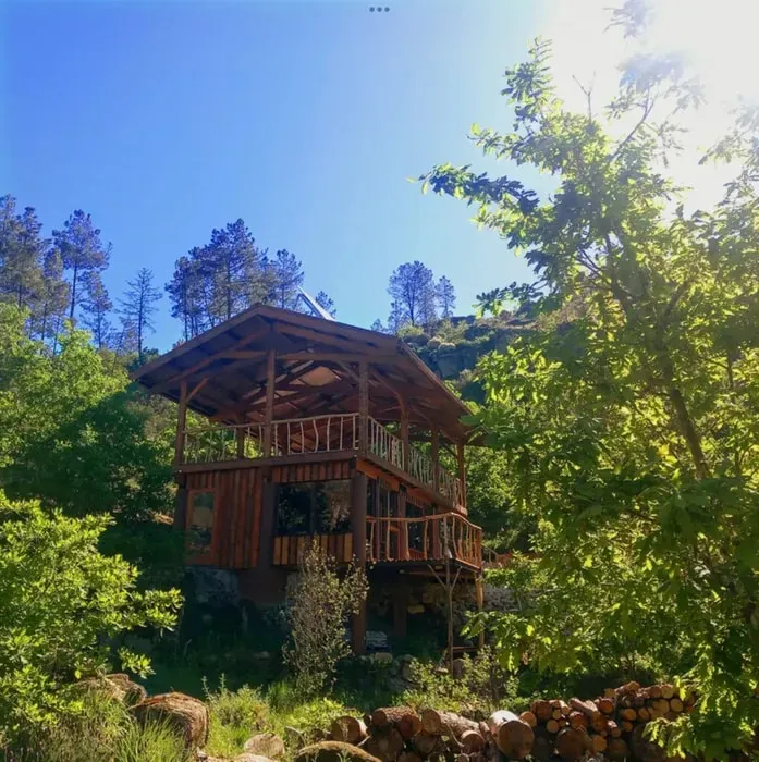 AYA Retreat Valley — AYA Retreat Valley is set in the serene Portuguese countryside near Vila Longa, offering a peaceful escape from urban noise. The venue features a spacious 650 sq. ft. upstairs deck with views down to a river, providing an inspiring backdrop for activities and yoga practice. The commitment to being off-grid enhances the sense of being truly immersed in nature.