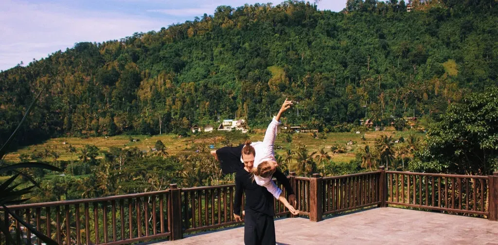 Bali Motion Fest — The festival site is an oasis set in the heart of Bali's Sidemen village. Guests are surrounded by picturesque rolling hills, vibrant terraced rice paddies, and the crystal-clear waters of the Udam River, offering a truly immersive natural experience.
