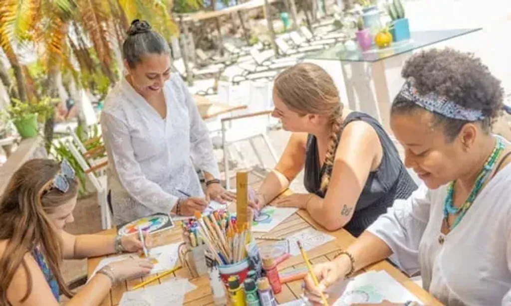 Befriend Yourself Retreat — The retreat unfolds in the vibrant setting of Bapor Kibra, Willemstad, Curaçao, utilizing the comfortable facilities of the Dolphin Suites hotel. This includes access to air-conditioned conference spaces for workshops, a serene garden, and a restaurant. The tropical surroundings are embraced with planned beach sessions and a city excursion, offering a dynamic blend of focused introspection and local cultural immersion.
