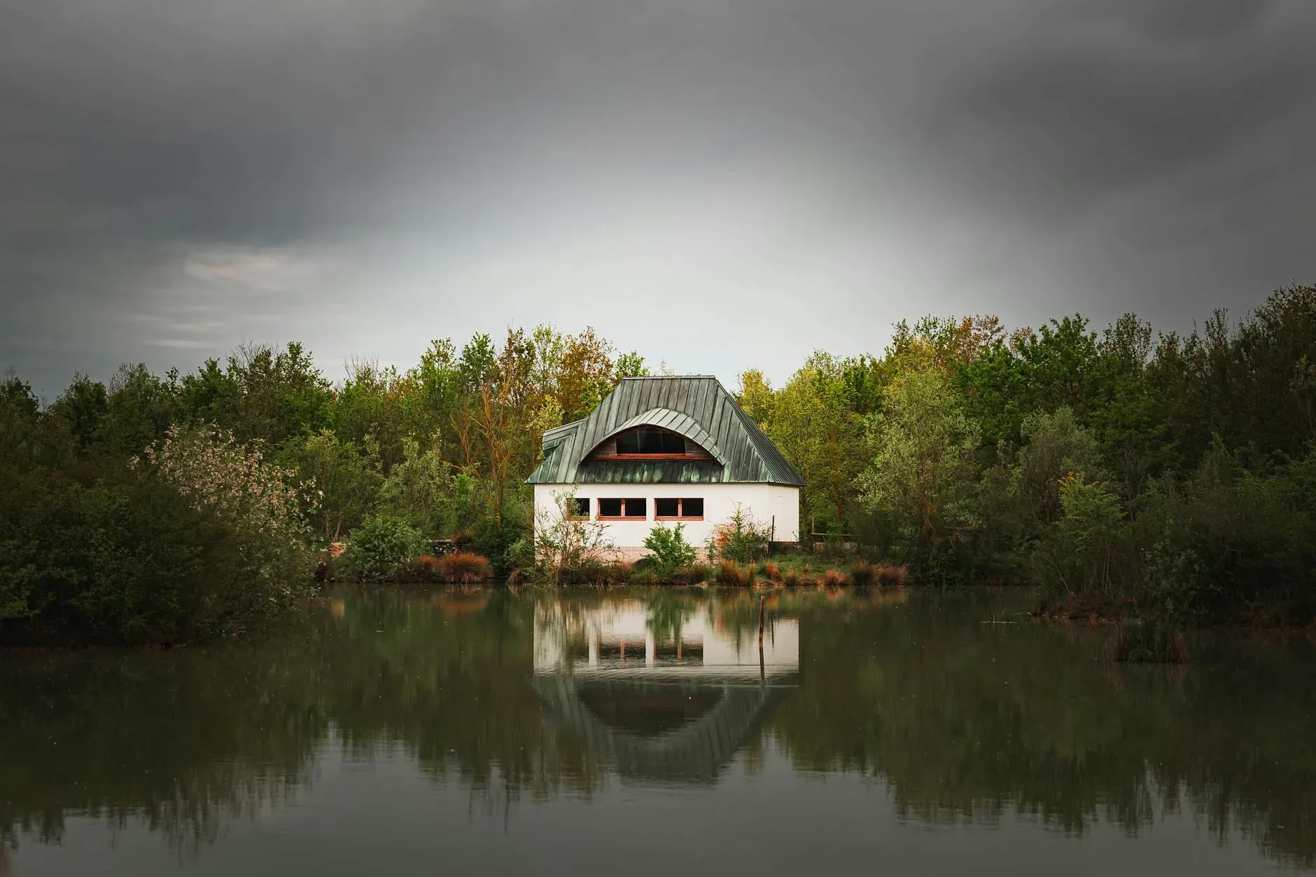 Bella vita private resort — The resort is set on 110 acres of natural landscape, featuring a private lake teeming with fish. The atmosphere balances tranquil natural surroundings with a variety of recreational facilities, creating a dynamic environment for both relaxation and activity.