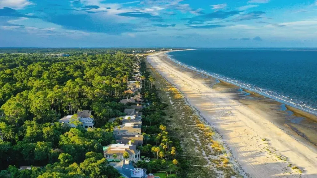 Better Yoga — This stunning property is located just one street back from the ocean in the peaceful Sea Pines neighborhood of Hilton Head Island. Guests can enjoy a fantastic pool and patio area, with a direct path leading to the beach in just one minute, offering a serene coastal environment for relaxation and practice.