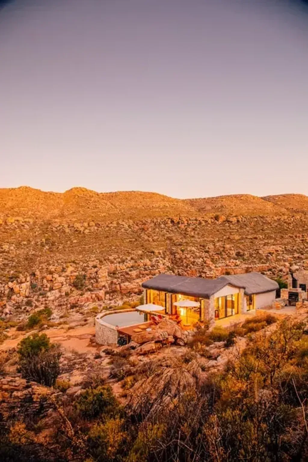 Bliss & Stars — set within a vast 1,350-hectare valley along the Doring River, Bliss & Stars is situated in the dramatic Cederberg Mountains of South Africa. This remote, off-the-grid location ensures absolute privacy and an immersive natural environment, far from the distractions of daily life. The landscape is ruggedly beautiful, offering a profound sense of stillness and connection to the earth and sky.