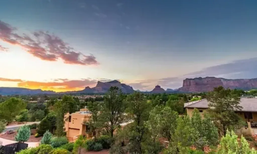 Bloom: Journey to Self-Love — set in the spiritual heart of Sedona, the center is surrounded by the dramatic beauty of red rock formations. The atmosphere is one of tranquility and natural grandeur, with direct access to National Forest and Red Rock Trails just two blocks away, inviting exploration and contemplation amidst the stunning landscape.