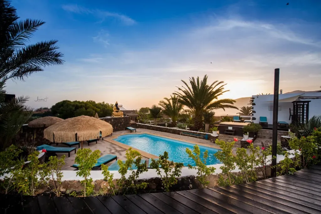 Canary Islands Yoga + Pilates Retreat — Perched on the beautiful island of Fuerteventura, the retreat offers stunning views of the ocean and surrounding countryside. The villa itself is a testament to Spanish charm, with its white-washed walls and wooden beams framing a lush internal courtyard. Gardens with a pool and jacuzzi provide ample space for relaxation under the Canary Islands sun.