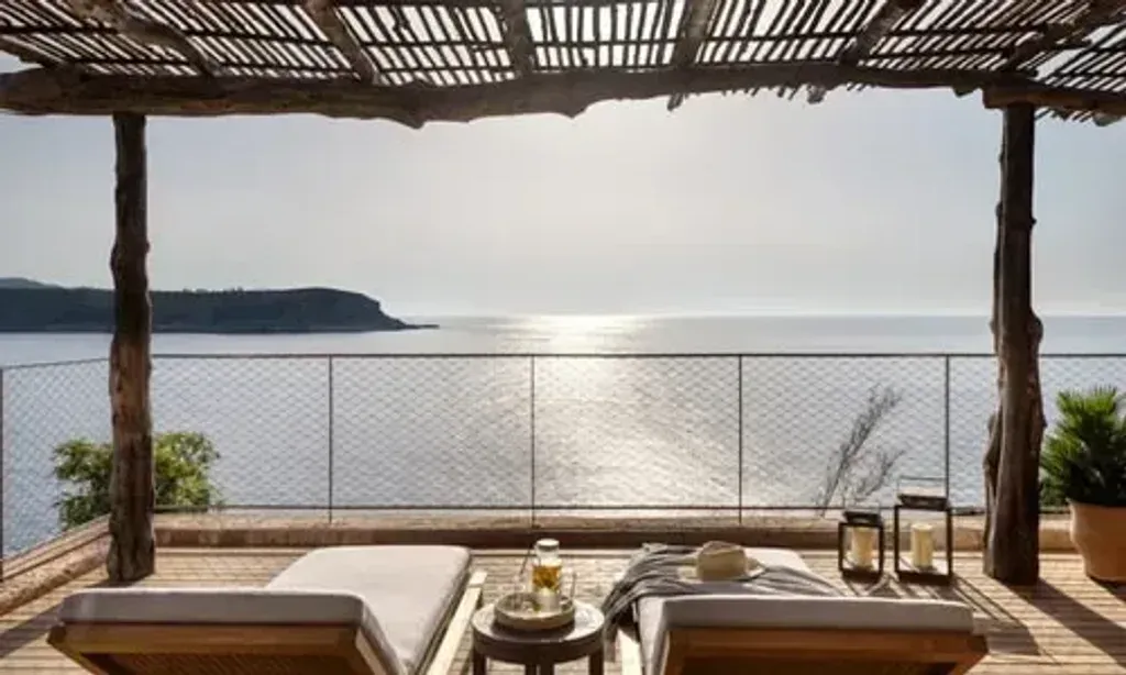 Consciouz — Perched on the northern tip of Ibiza, the Six Senses resort provides a breathtaking setting. The atmosphere blends luxury with a deep respect for community and spirituality, all within an eco-friendly architectural design. Guests can expect mesmerizing views, a sense of sanctuary, and an environment that encourages exploration and rejuvenation.