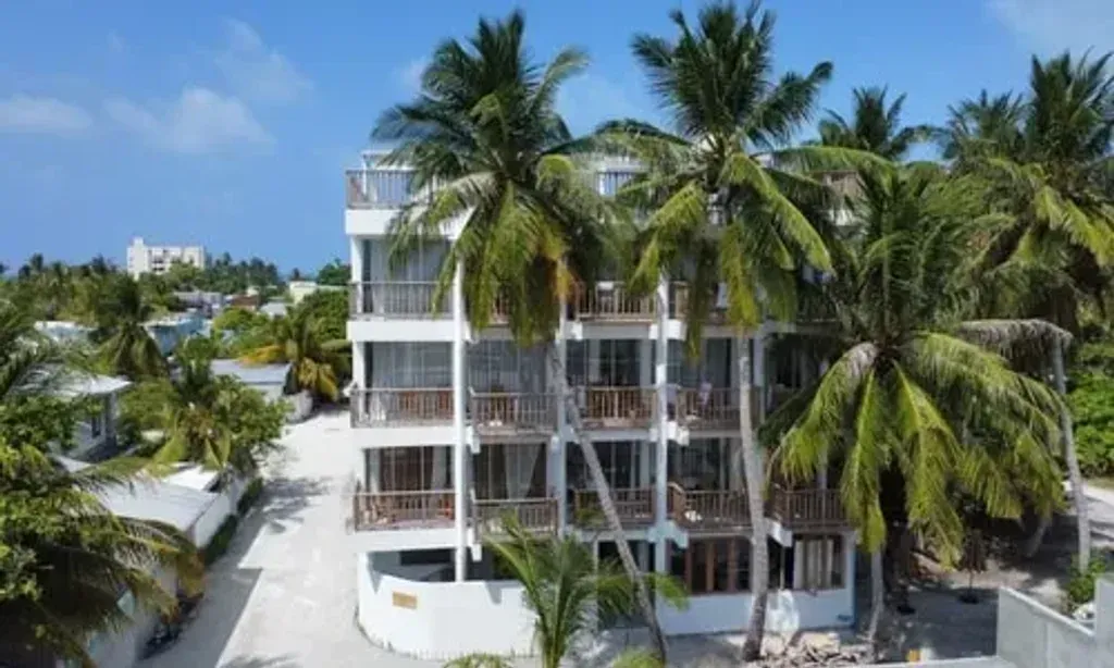 Coral Inn — Coral Inn is situated on Thulusdhoo Island, a picturesque location in the Maldives known for its natural beauty. The boutique hotel offers ocean-facing rooms, providing a serene backdrop of turquoise waters and gentle sea breezes, well suited to relaxation and creative inspiration.