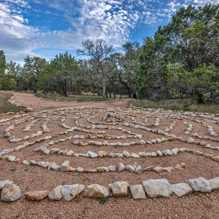Core Concepts Counseling — The retreat unfolds on 46 acres of the beautiful Retreat Ranch, set in the heart of Texas Hill Country, about an hour from Austin. This family-owned center is dedicated to fostering connection, renewal, and inspiration, with a deep respect for nature, animals, and community. The environment is designed to work with the land, featuring over 60% repurposed materials, creating a unique and character-rich space.