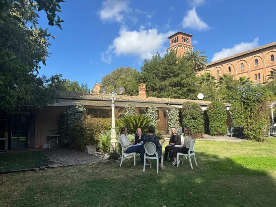 Designing Your Life Italy — set on Rome’s tranquil Aventine Hill, the workshop venue is a historic sanctuary. Surrounded by lush gardens, climbing vines, and sun-washed brick, it offers a hidden corner of the city where time slows down, and the outside world feels distant. This serene environment supports deep inner work and reflection.
