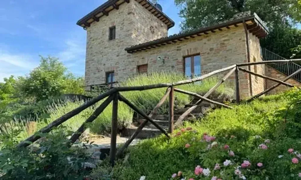 D&G Design Italy — Agriturismo Ramuse is situated in a serene valley in Le Marche, offering a peaceful backdrop for your retreat. Step outside and you're greeted by stunning views of rolling countryside, with fruit gardens providing vistas of valleys and mountains. It's an idyllic setting that truly embodies the charm of rural Italy.