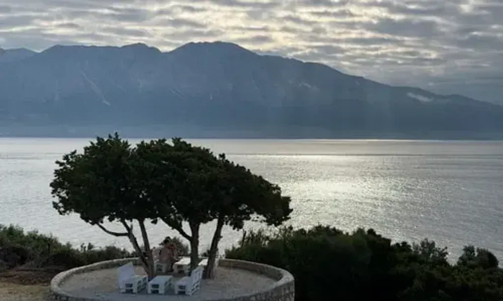 EARTH & HEAVEN Retreat — The retreat is intentionally situated in a natural, distraction-free environment directly on St. Ioannis Beach in Paleros, Greece. Activities primarily unfold outdoors, with dedicated platforms by the sea, ensuring a deep connection with the coastal landscape. Even in the rare event of rain, beautiful indoor alternatives are available, maintaining the serene atmosphere.